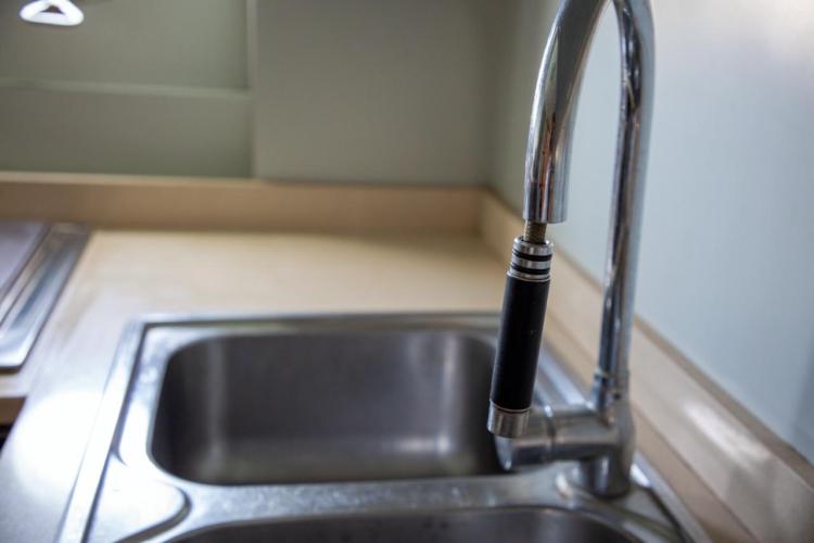 Kitchen sink and faucet on a 1972 Benetti 33 yacht.