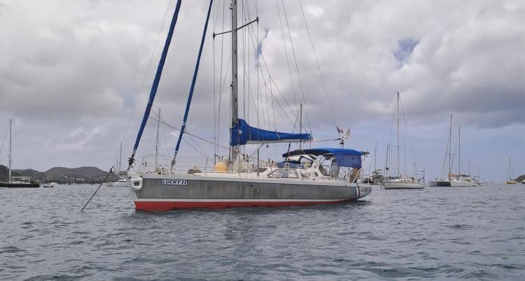 Sailboat "Patago 40" anchored in a calm bay under cloudy skies, 2019 model.