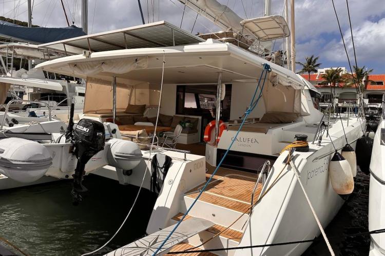 2016 Fountaine Pajot Ipanema 58 catamaran docked, featuring spacious deck and modern design.